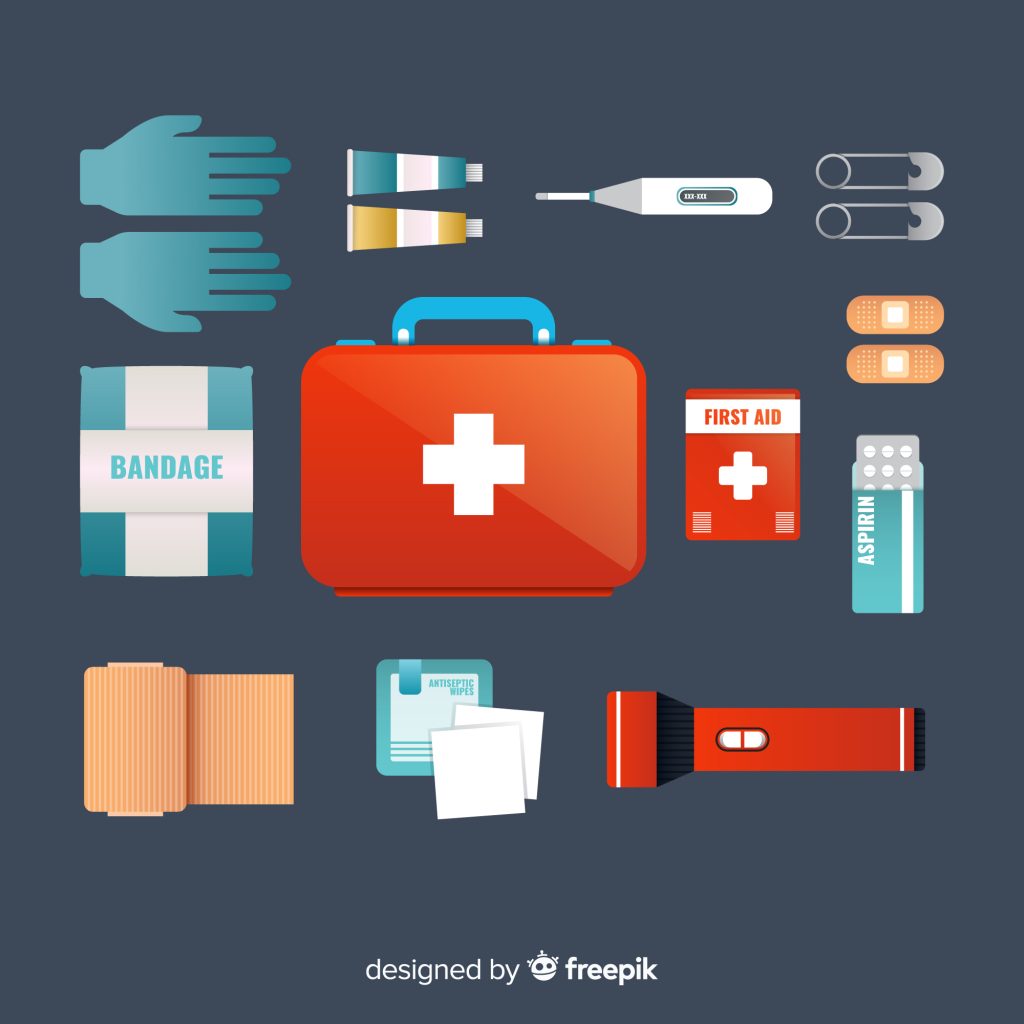 Graphic showcasing a red emergency kit and various items surrounding it, such as gloves, bandages, ointment,  flashlight, safety pins and more.